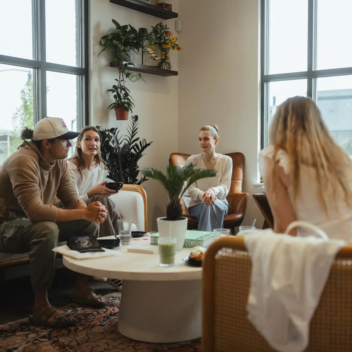 Friends sharing coffee in a café, sample photograph